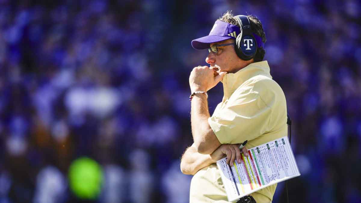 Washington Huskies head coach Jedd Fisch stands on the sideline during a second quarter timeout against the Ohio State Buckeyes at Husky Stadium.