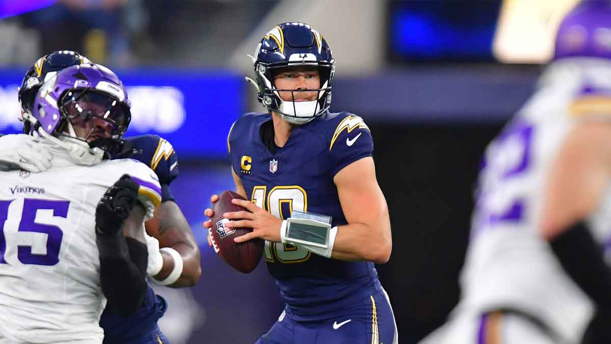 Los Angeles Chargers quarterback Justin Herbert (10) drops back to pass against the Minnesota Vikings during the first half at SoFi Stadium.
