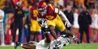 Southern California Trojans running back Waymond Jordan (2) runs the ball against Michigan State Spartans linebacker Darius Snow (23) during the first half at the Los Angeles Memorial Coliseum.
