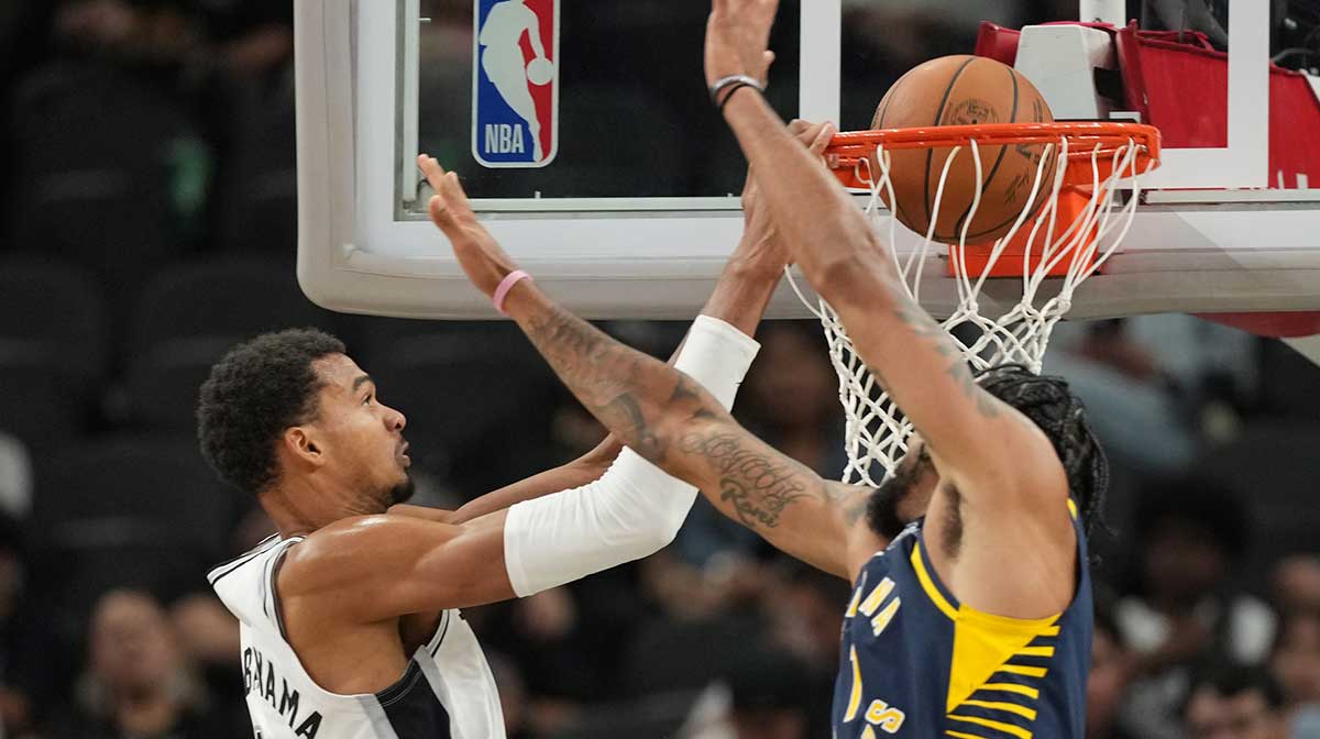 San Antonio Spurs forward Victor Wembanyama (1) dunks over Indiana Pacers forward Obi Toppin (1) during the second half at Frost Bank Center.