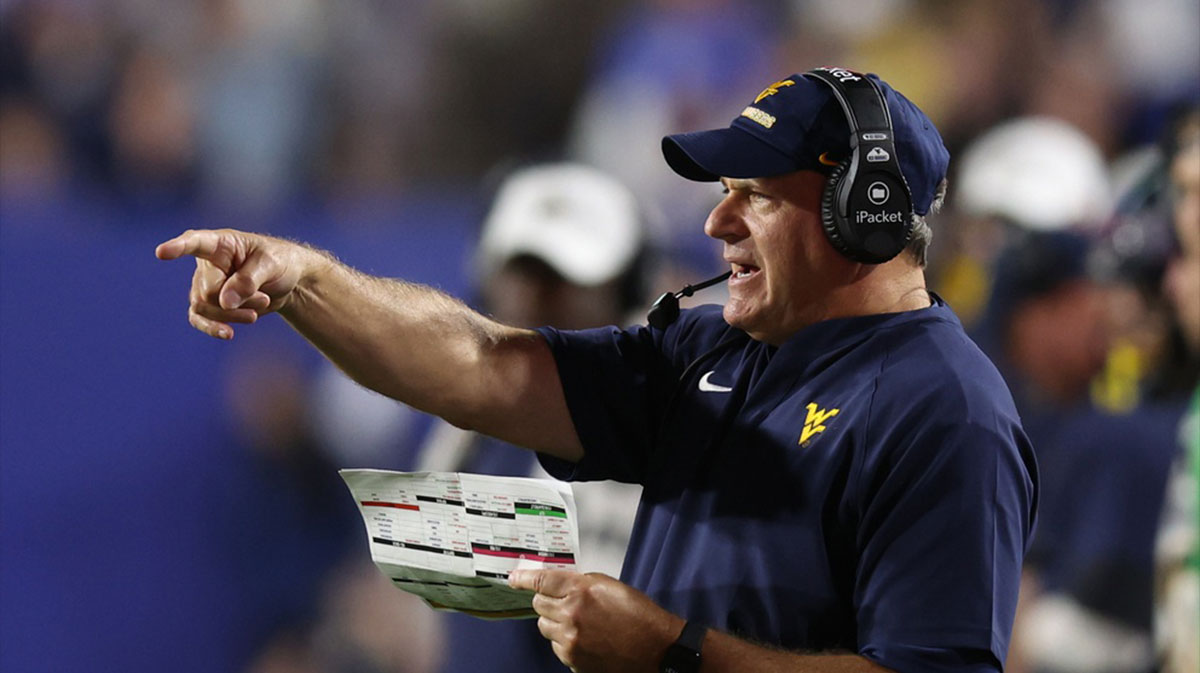 https://wp.clutchpoints.com/wp-content/uploads/2025/10/West-Virginia-Mountaineers-head-coach-Rich-Rodriguez-coaches.jpg