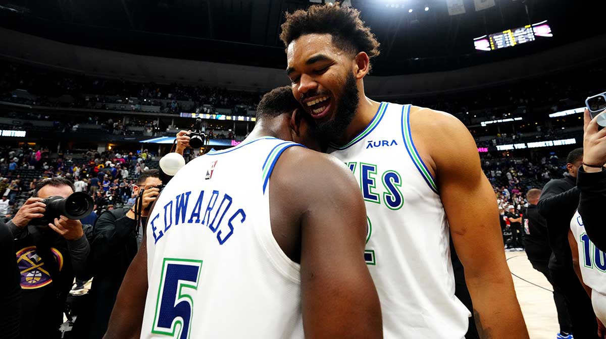 Minnesota Timberwolves center Karl-Anthony Towns (32) and Anthony Edwards (5) celebrate defeating the Denver Nuggets in game seven of the second round for the 2024 NBA playoffs at Ball Arena.