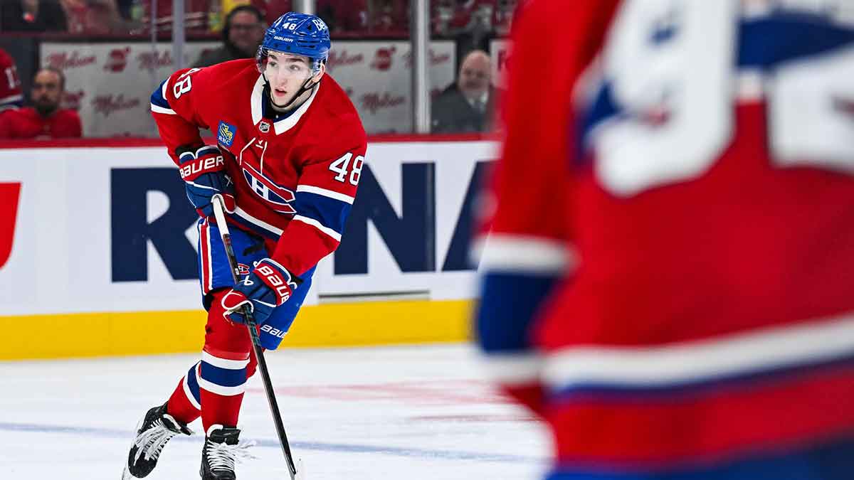 Montreal Canadiens defenseman Lane Hutson (48) plays the puck against the Chicago Blackhawks.