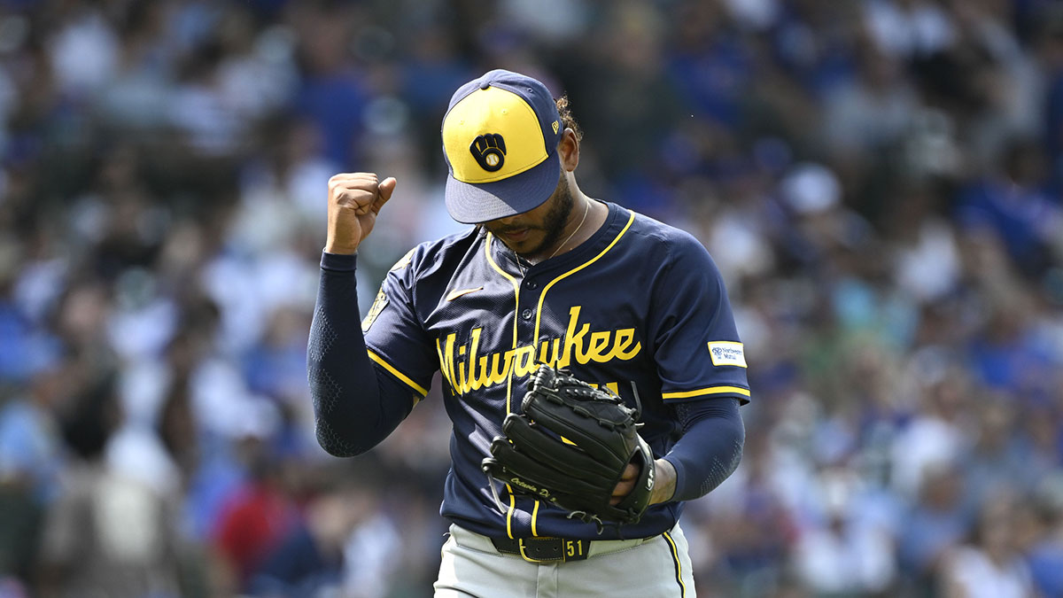 Milwaukee Brewers pitcher Freddy Peralta (51) pumps his fist after the sixth inning against the Chicago Cubs at Wrigley Field.