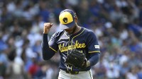 Milwaukee Brewers pitcher Freddy Peralta (51) pumps his fist after the sixth inning against the Chicago Cubs at Wrigley Field.