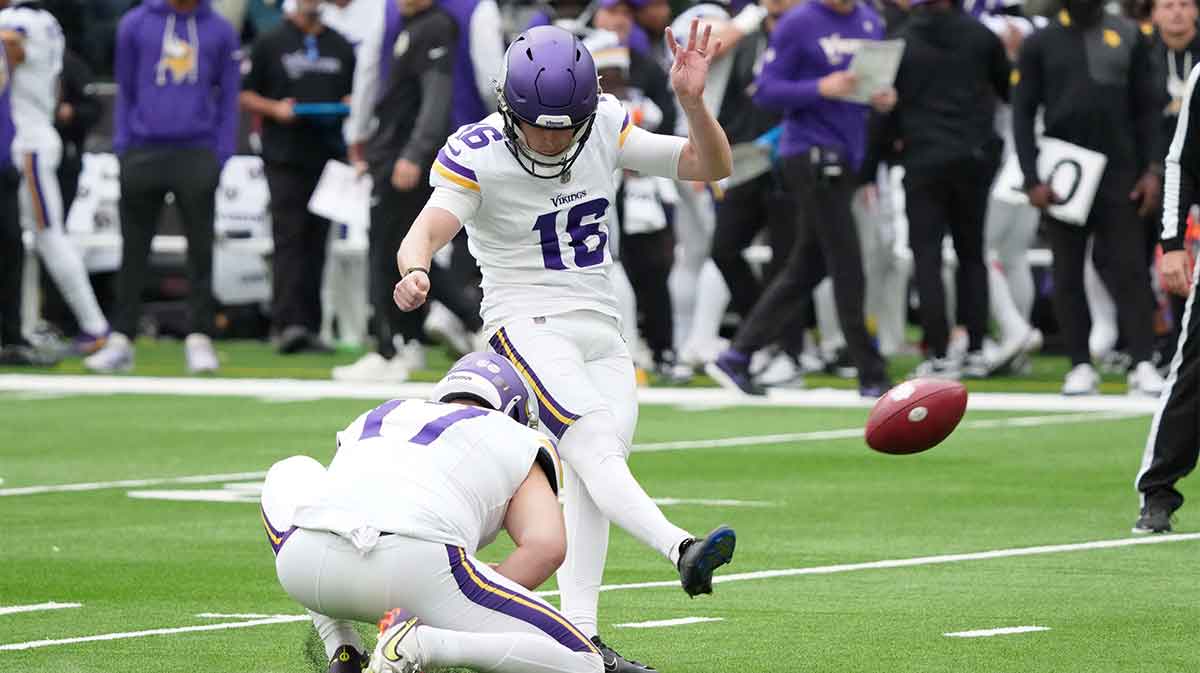Minnesota Vikings kicker Will Reichard (16) kicks a point after attempt against the Cleveland Browns during the third quarter of an NFL International Series game at Tottenham Hotspur Stadium.