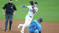 Toronto Blue Jays second baseman Isiah Kiner-Falefa (7) steals second base against Los Angeles Dodgers second baseman Tommy Edman (25) in the eighth inning during game five of the 2025 MLB World Series at Dodger Stadium.