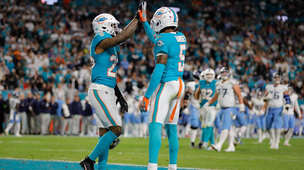 Miami Dolphins cornerback Xavien Howard (25) and cornerback Jalen Ramsey (5) celebrate after a play against the Tennessee Titans during the second quarter at Hard Rock Stadium.