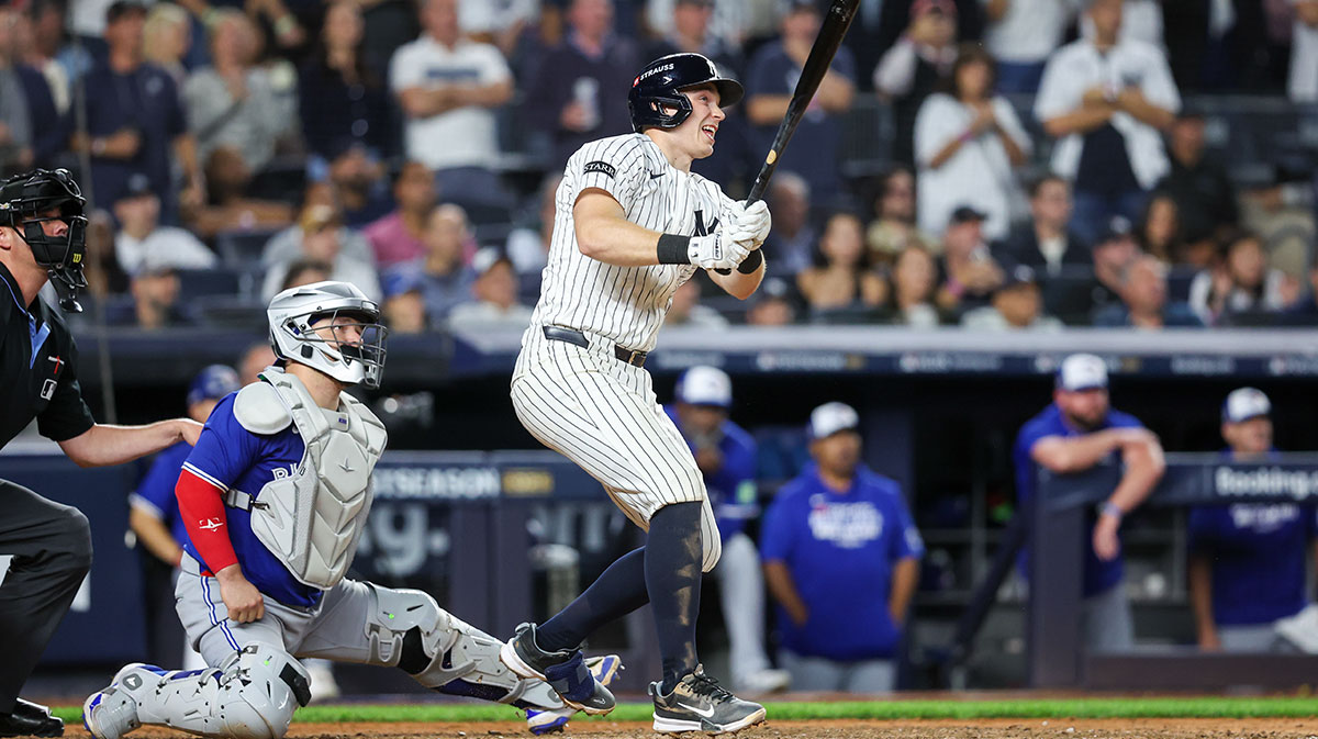 New York Yankees first baseman Ben Rice (11) hits an RBI single in the sixth inning against the Toronto Blue Jays during game three of the ALDS round for the 2025 MLB playoffs at Yankee Stadium.