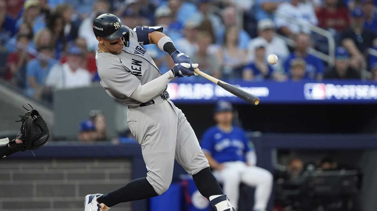 New York Yankees right fielder Aaron Judge (99) hits a RBI single in the seventh inning against the Toronto Blue Jays during game two of the ALDS round for the 2025 MLB playoffs at Rogers Centre.