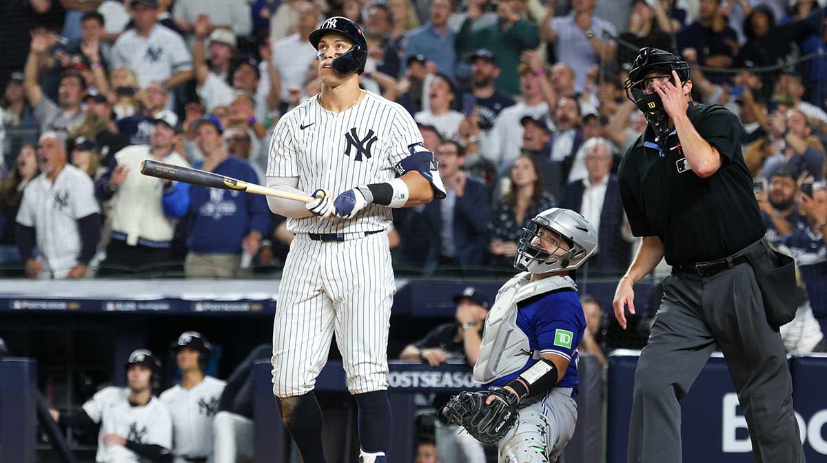 New York Yankees outfielder Aaron Judge (99) hits a three-run home run in the fourth inning against the Toronto Blue Jays during game three of the ALDS round for the 2025 MLB playoffs at Yankee Stadium.