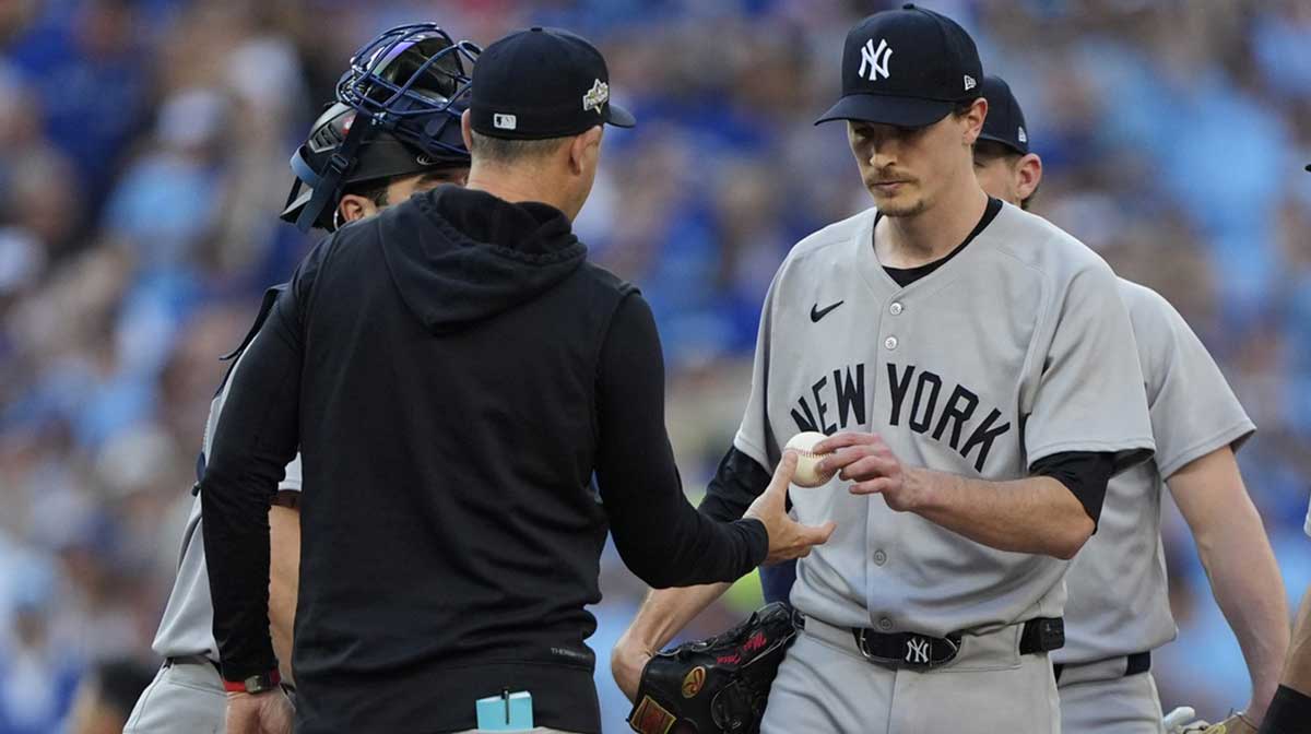 New York Yankees manager Aaron Boone (17) relieves pitcher Max Fried (54) in the fourth inning against the Toronto Blue Jays during game two of the ALDS round for the 2025 MLB playoffs at Rogers Centre.