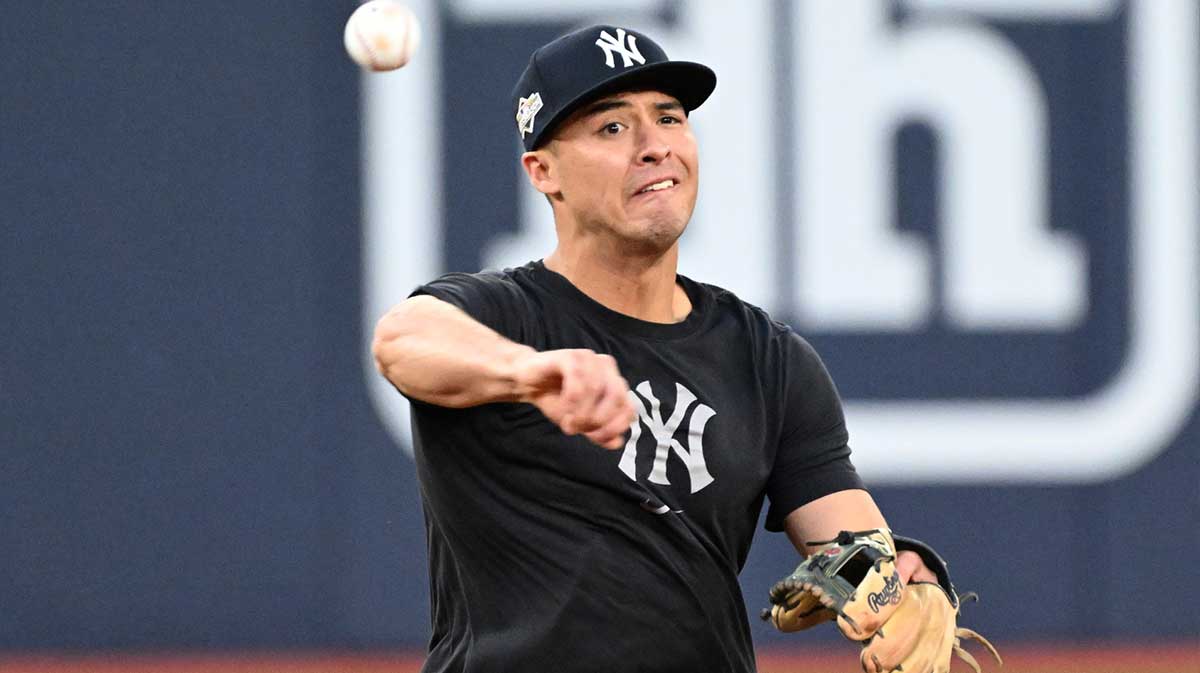 New York Yankees shortstop Anthony Volpe (11) throws the ball during workouts at Rogers Centre.