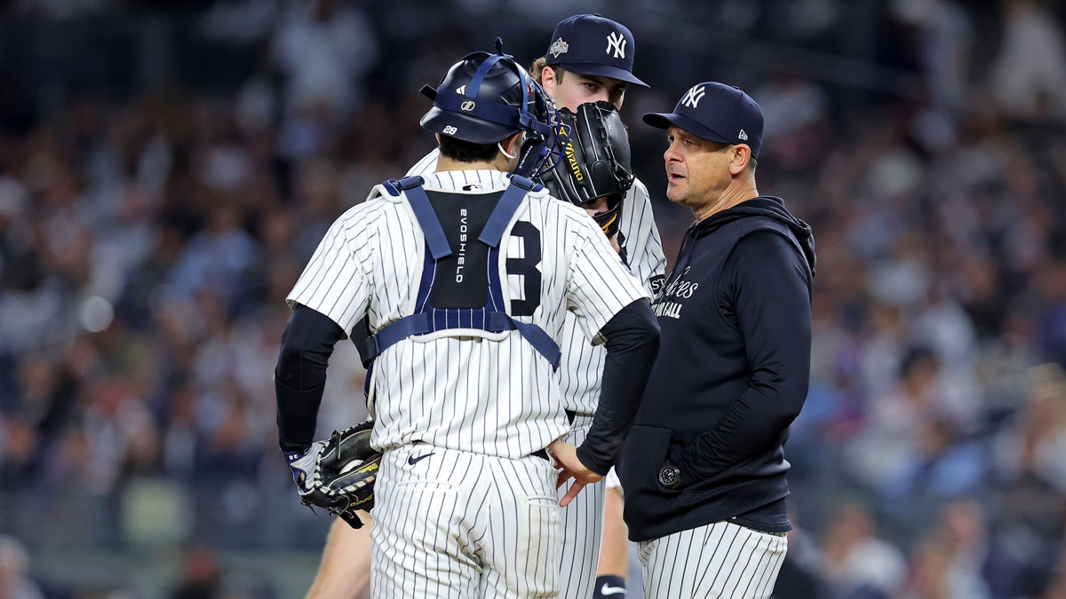 New York Yankees manager Aaron Boone visits pitcher Cam Schlittler (31) on mound during the sixth inning against the Toronto Blue Jays during game four of the ALDS round for the 2025 MLB playoffs at Yankee Stadium.