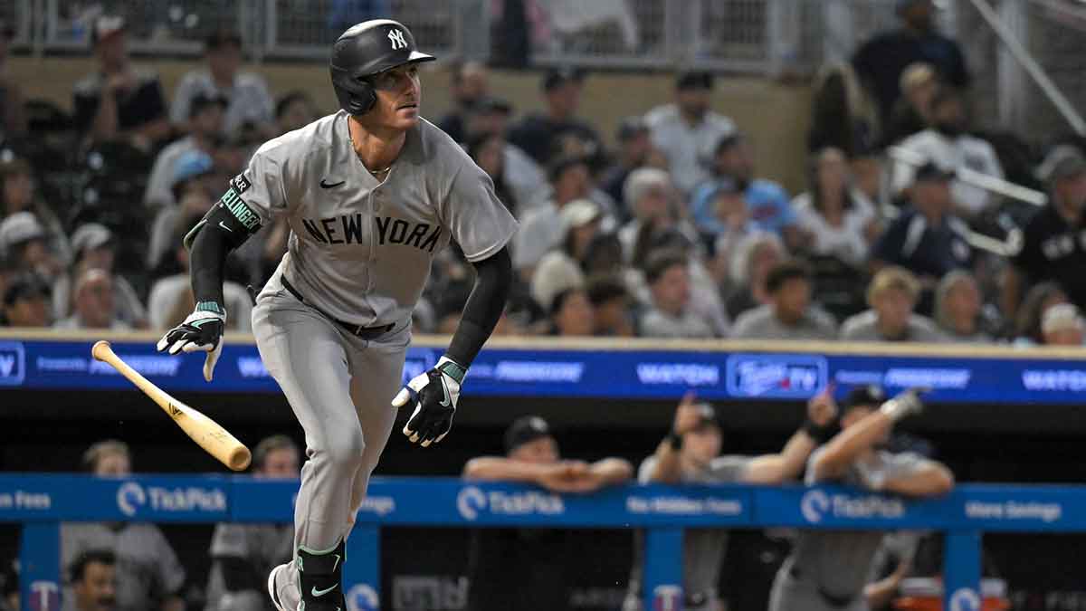 New York Yankees outfielder Cody Bellinger (35) hits a two-run home run against the Minnesota Twins during the ninth inning at Target Field.