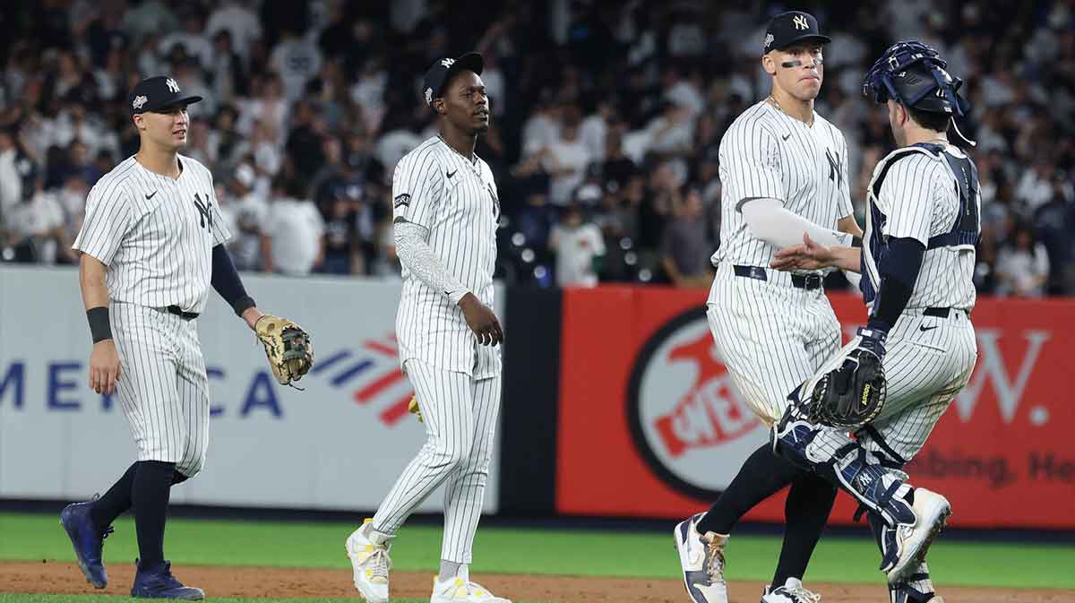Yankees right fielder Aaron Judge (99) and catcher Austin Wells (28) celebrate