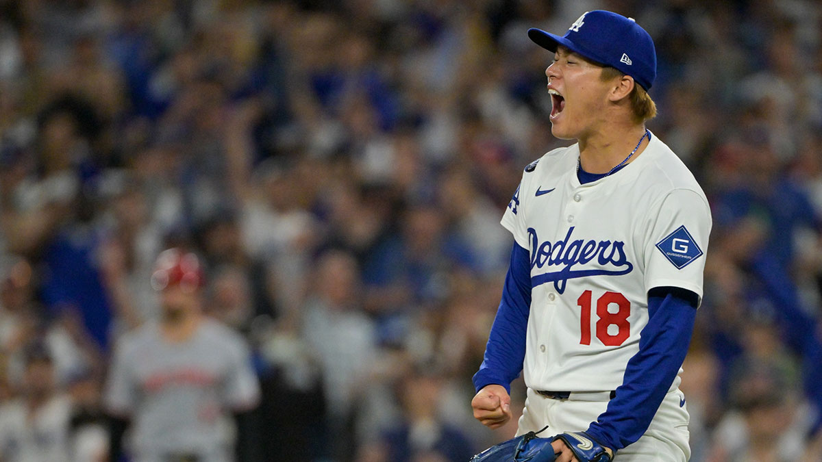 Los Angeles Dodgers starting pitcher Yoshinobu Yamamoto (18) celebrates after throwing against the Cincinnati Reds in the sixth inning during game two of the Wildcard round for the 2025 MLB playoffs at Dodger Stadium.