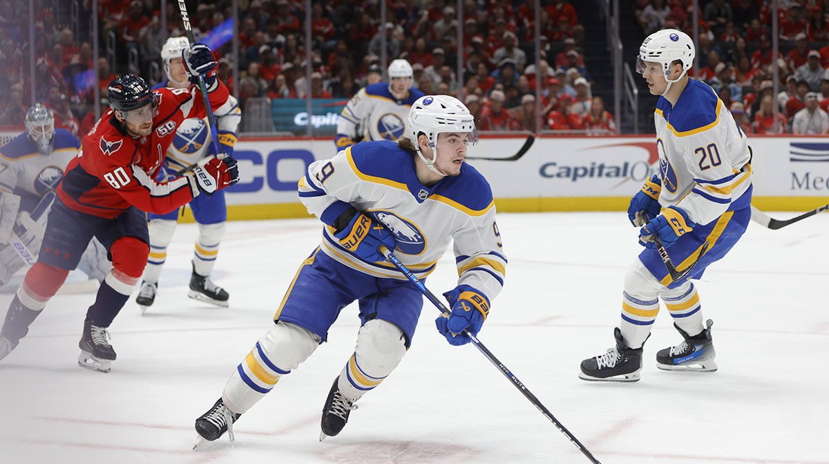 Buffalo Sabres left wing Zach Benson (9) skates with the puck past Washington Capitals left wing Pierre-Luc Dubois (80) during the second half at Audi Field.