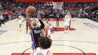 Sacramento Kings guard Zach LaVine (8) goes to the basket against Chicago Bulls guard Josh Giddey (3) during the first half at United Center.