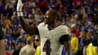 Baltimore Ravens wide receiver Zay Flowers waves to fans after scoring a touchdown.