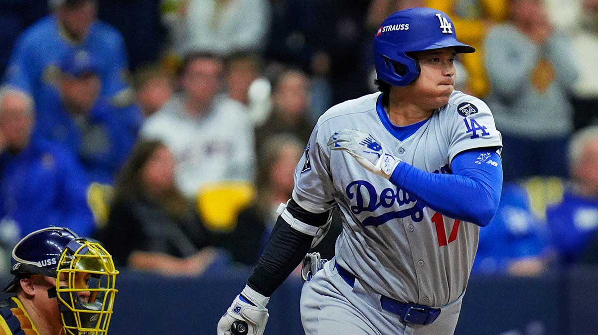 Los Angeles Dodgers designated hitter Shohei Ohtani (17) singles on a ground ball to Milwaukee Brewers right fielder Jackson Chourio (11) during the seventh inning of the National League Championship Series game October 14, 2025 at American Family Field in Milwaukee, Wisconsin. © Jovanny Hernandez / Milwaukee Journal Sentinel / USA TODAY NETWORK via Imagn Images