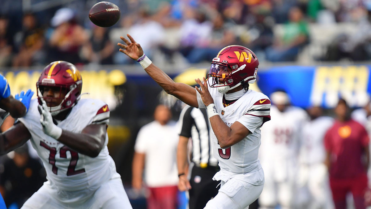 Washington Commanders quarterback Jayden Daniels (5) throws a pass against the Los Angeles Chargers in the second half at SoFi Stadium.
