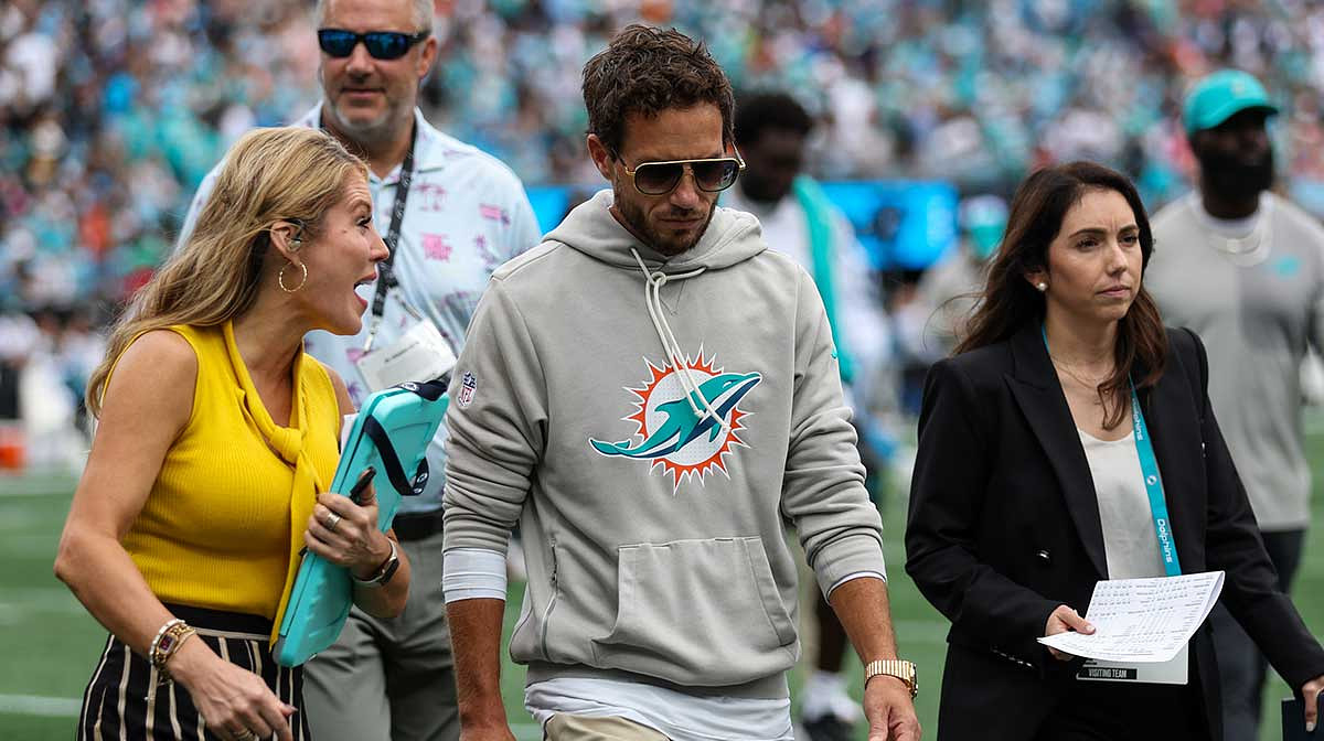 Miami Dolphins head coach Mike McDaniel talks with a reporter at the end of the first half of the Carolina Panthers and Miami Dolphins game at Bank of America Stadium.