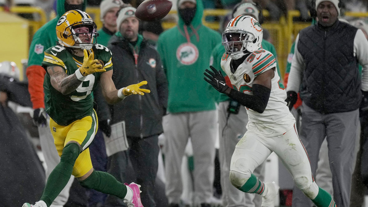 Green Bay Packers' Christian Watson (9) makes a 46-yard reception while being covered by Miami Dolphins cornerback Storm Duck (36) during the third quarter of their game Thursday, November 28, 2024 at Lambeau Field in Green Bay, Wisconsin.