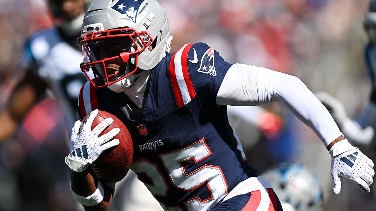 New England Patriots cornerback Marcus Jones (25) returns a punt for a touchdown against the Carolina Panthers during the first half at Gillette Stadium.
