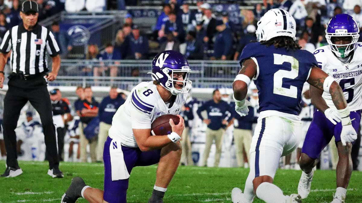 Northwestern Wildcats quarterback Preston Stone (8) takes a knee to run out the clock during the fourth quarter against the Penn State Nittany Lions at Beaver Stadium.