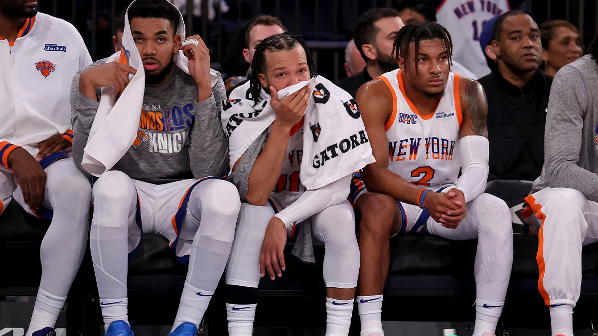 Jan 10, 2025; New York, New York, USA; New York Knicks center Karl-Anthony Towns (32) and guards Jalen Brunson (11) and Miles McBride (2) watch from the bench during the fourth quarter against the Oklahoma City Thunder at Madison Square Garden. Mandatory Credit: Brad Penner-Imagn Images