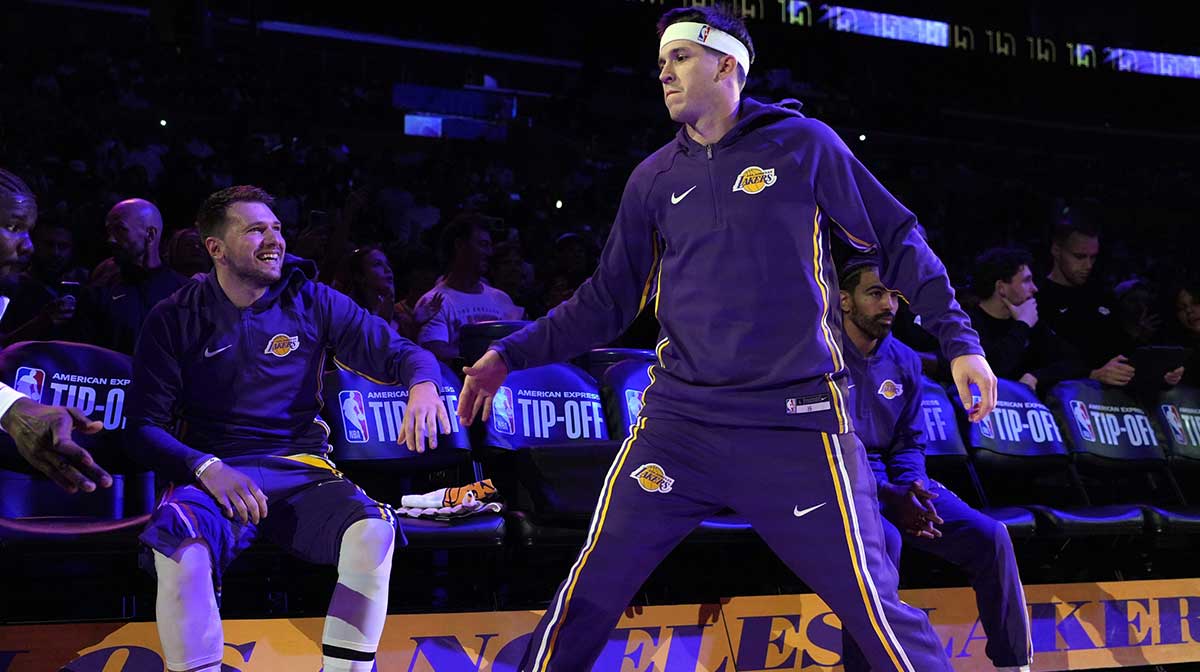 Los Angeles Lakers guard Luka Doncic (left) and guard Austin Reaves (15) interact before the game against the Minnesota Timberwolves at Crypto.com Arena.