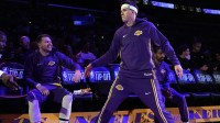 Los Angeles Lakers guard Luka Doncic (left) and guard Austin Reaves (15) interact before the game against the Minnesota Timberwolves at Crypto.com Arena.