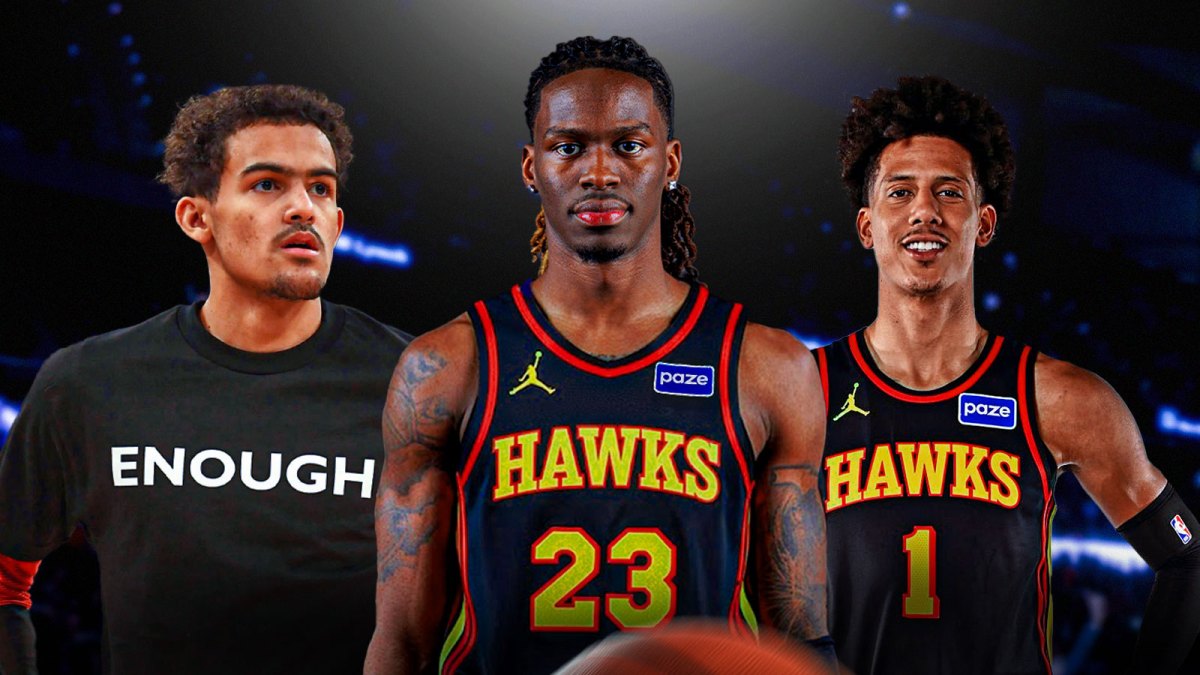 Keon Ellis in Hawks uniform (with number 23 please), with Trae Young (in casual clothes) and Jalen Johnson smiling beside him