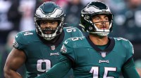 Jaelan Phillips in an Eagles jersey with the number 15, with Christian Wilkins next to him in an Eagles Jersey.