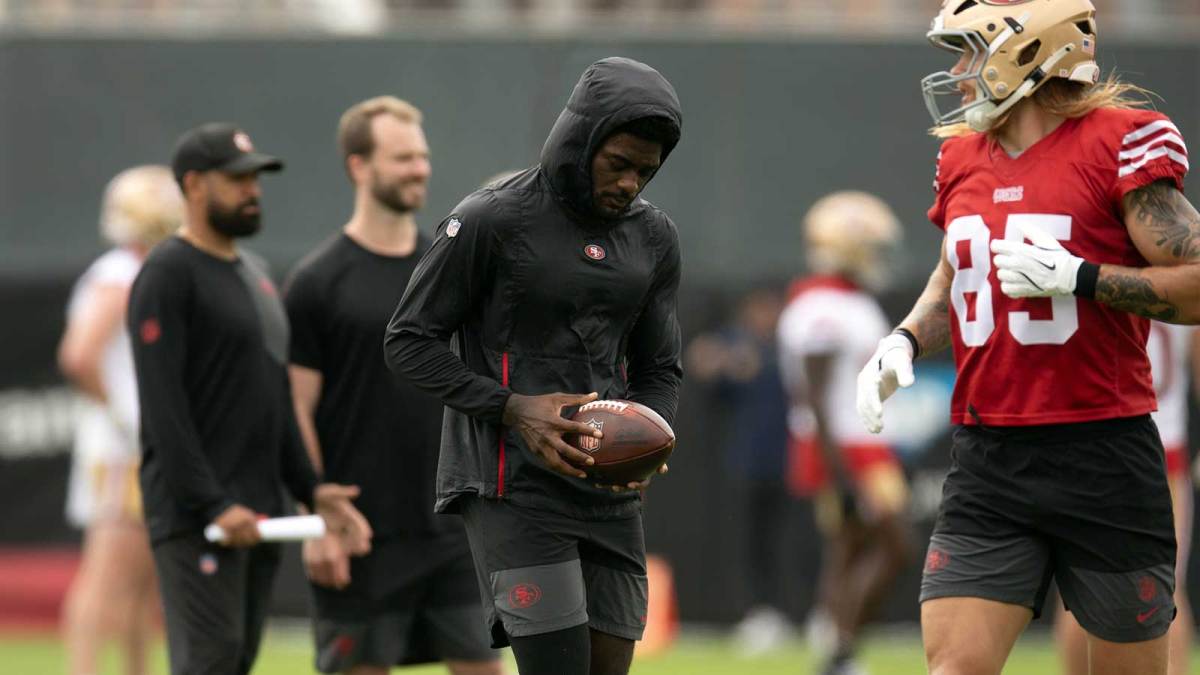 Still recovering from knee surgery, San Francisco 49ers wide receiver Brandon Aiyuk (left) hangs out with teammate George Kittle (85) during the second day of training camp.