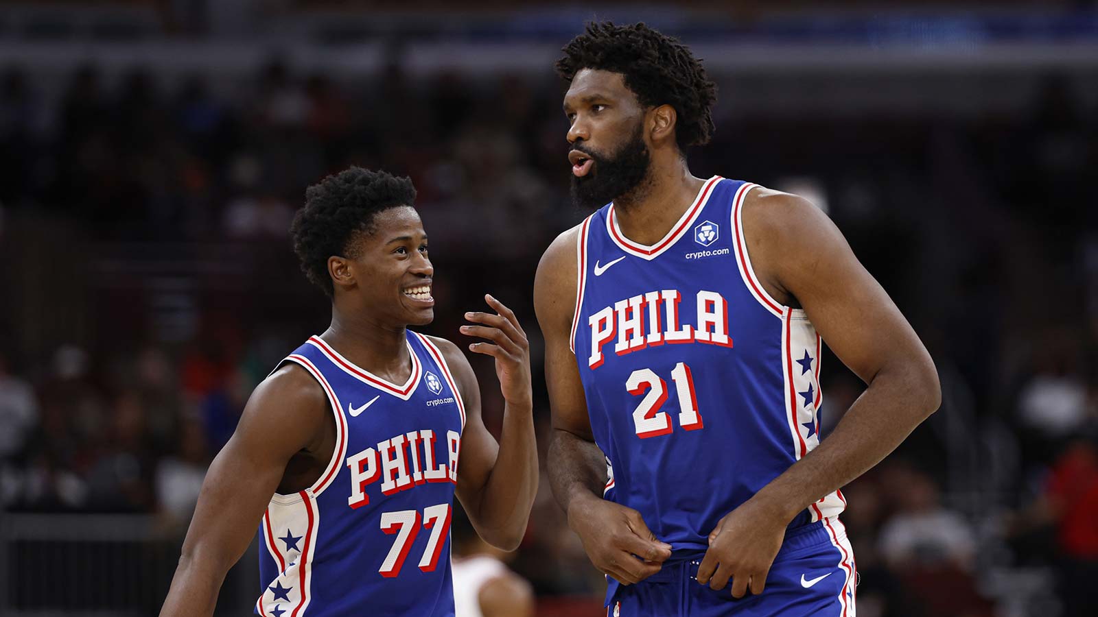 76ers guard VJ Edgecombe (77) chats with center Joel Embiid (21) during the first half of an NBA game against the Chicago Bulls at United Center