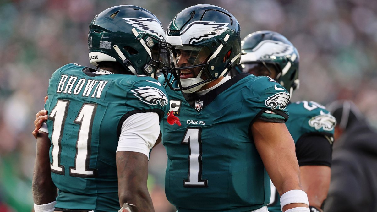 Philadelphia Eagles quarterback Jalen Hurts (1) and wide receiver A.J. Brown (11) celebrate after a touchdown against the Washington Commanders during the first half in the NFC Championship game at Lincoln Financial Field.