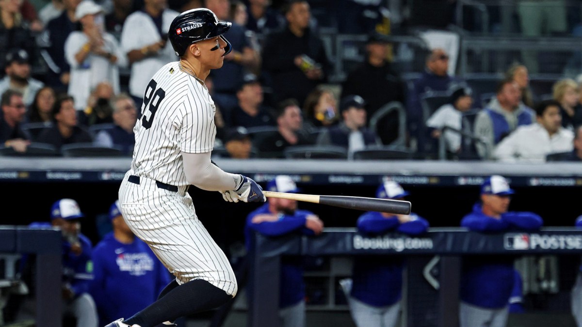 New York Yankees right fielder Aaron Judge (99) hits a single during the first inning against the Toronto Blue Jays during game four of the ALDS round for the 2025 MLB playoffs at Yankee Stadium.