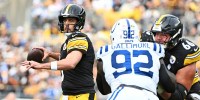 Pittsburgh Steelers quarterback Aaron Rodgers (8) drops back to make a pass during the first half against the Indianapolis Colts at Acrisure Stadium.