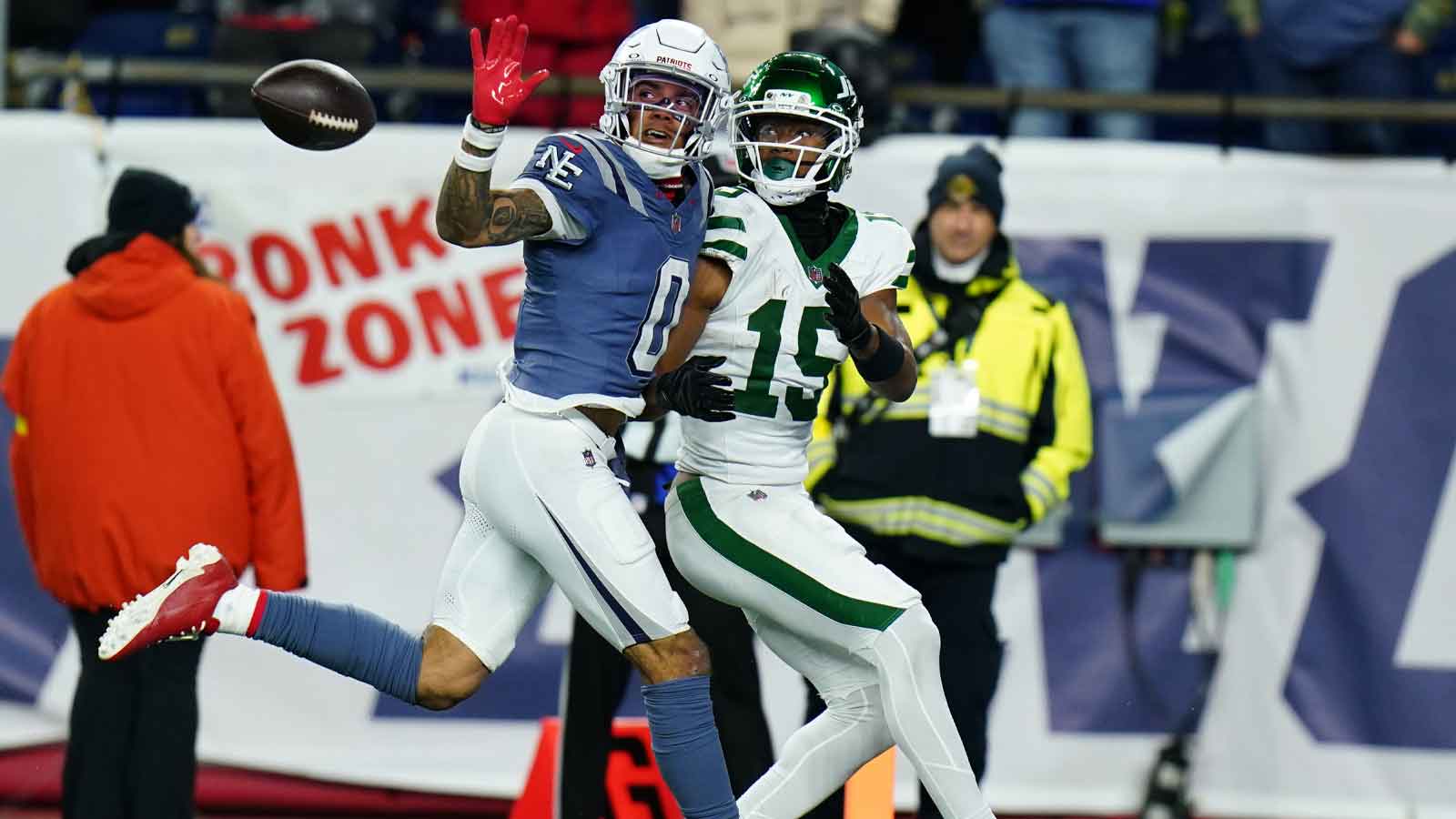 New England Patriots Christian Gonzalez cornerback (0) defends against New York Jets wide receiver Adonai Mitchell (15) in the fourth quarter at Gillette Stadium. 