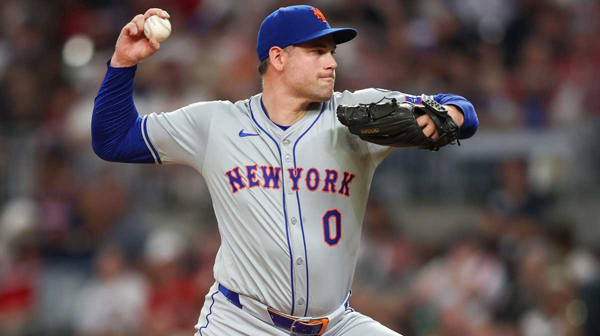 New York Mets relief pitcher Adam Ottavino (0) throws against the Atlanta Braves in the seventh inning at Truist Park.