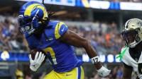 Los Angeles Rams wide receiver Davante Adams (17) makes a touchdown catch in front of New Orleans Saints cornerback Kool-Aid McKinstry (4) during the second half at SoFi Stadium