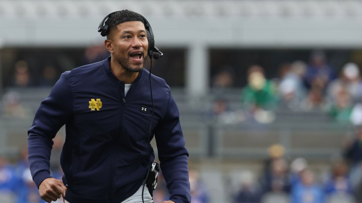 Notre Dame Fighting Irish head coach Marcus Freeman reacts after an Irish touchdown against the Pittsburgh Panthers during the second quarter at Acrisure Stadium.