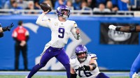 Minnesota Vikings quarterback J.J. McCarthy (9) throws a pass in the second quarter against the Detroit Lions at Ford Field.