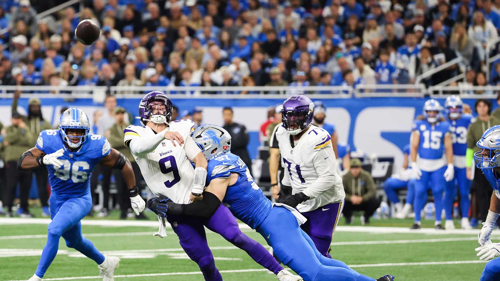 ; Detroit Lions edge Aidan Hutchinson (97) forces a bad pass from Minnesota Vikings quarterback J.J. McCarthy (9) in the third quarter at Ford Field. 