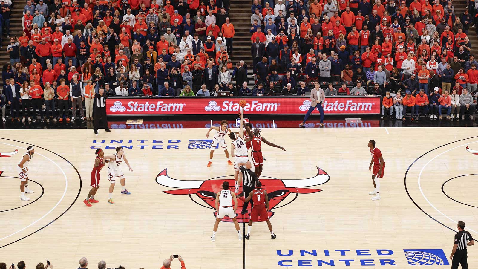 Illinois Fighting Illini center Zvonimir Ivisic (44) battles for the ball with Alabama Crimson Tide forward Taylor Bol Bowen (7) at the tip-off of a NCAA basketball game at United Center.