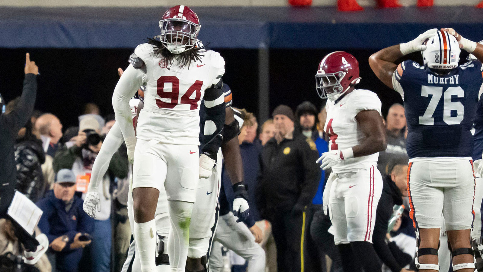 Alabama defensive lineman Edric Hill (94) celebrates an Alabama fumble recovery at Jordan-Hare Stadium. Alabama defeated Auburn 27-20. 