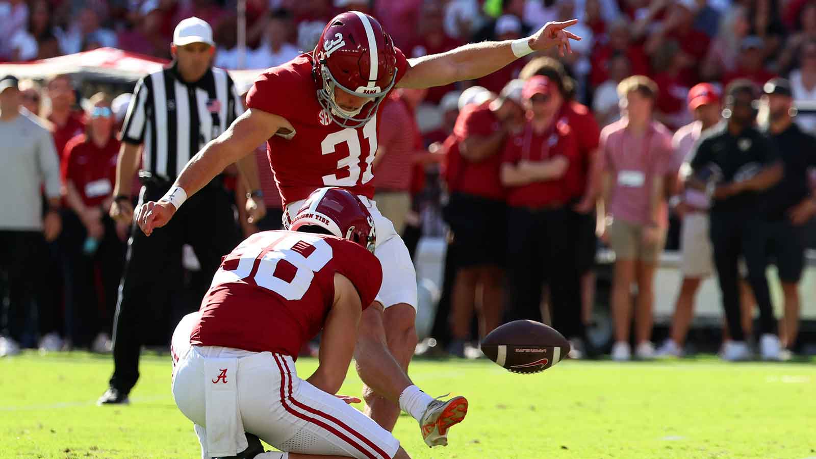 Alabama Crimson Tide kicker Conor Talty (31) kicks the ball during the second quarter against the Vanderbilt Commodores at Saban Field at Bryant-Denny Stadium