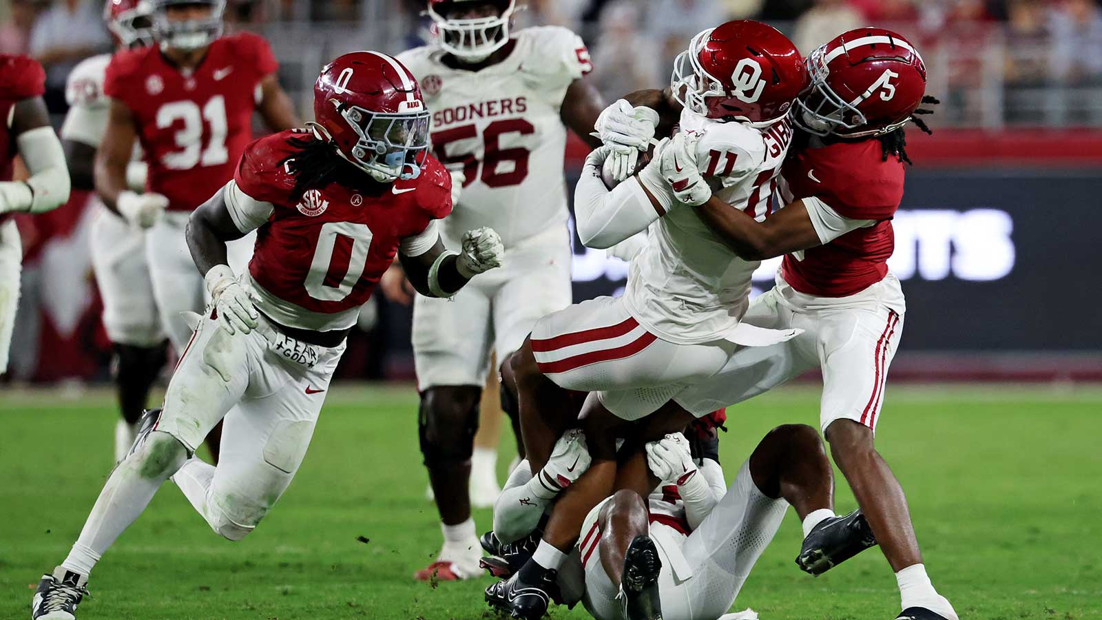 Oklahoma Sooners wide receiver Javonnie Gibson (11) is tackled by Alabama Crimson Tide wide receiver Germie Bernard (5) during the fourth quarter at Saban Field at Bryant-Denny Stadium.